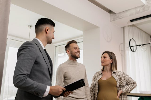 A landlord conducting a property tour with two tenants