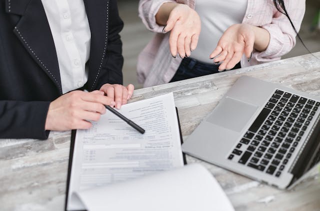 A landlord going over a contract with a tenant